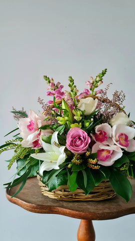 Pastel Basket Flower Arrangement.